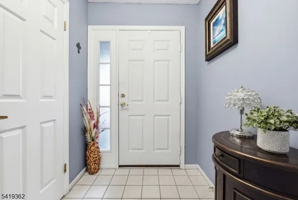 a view of a hallway and dining room