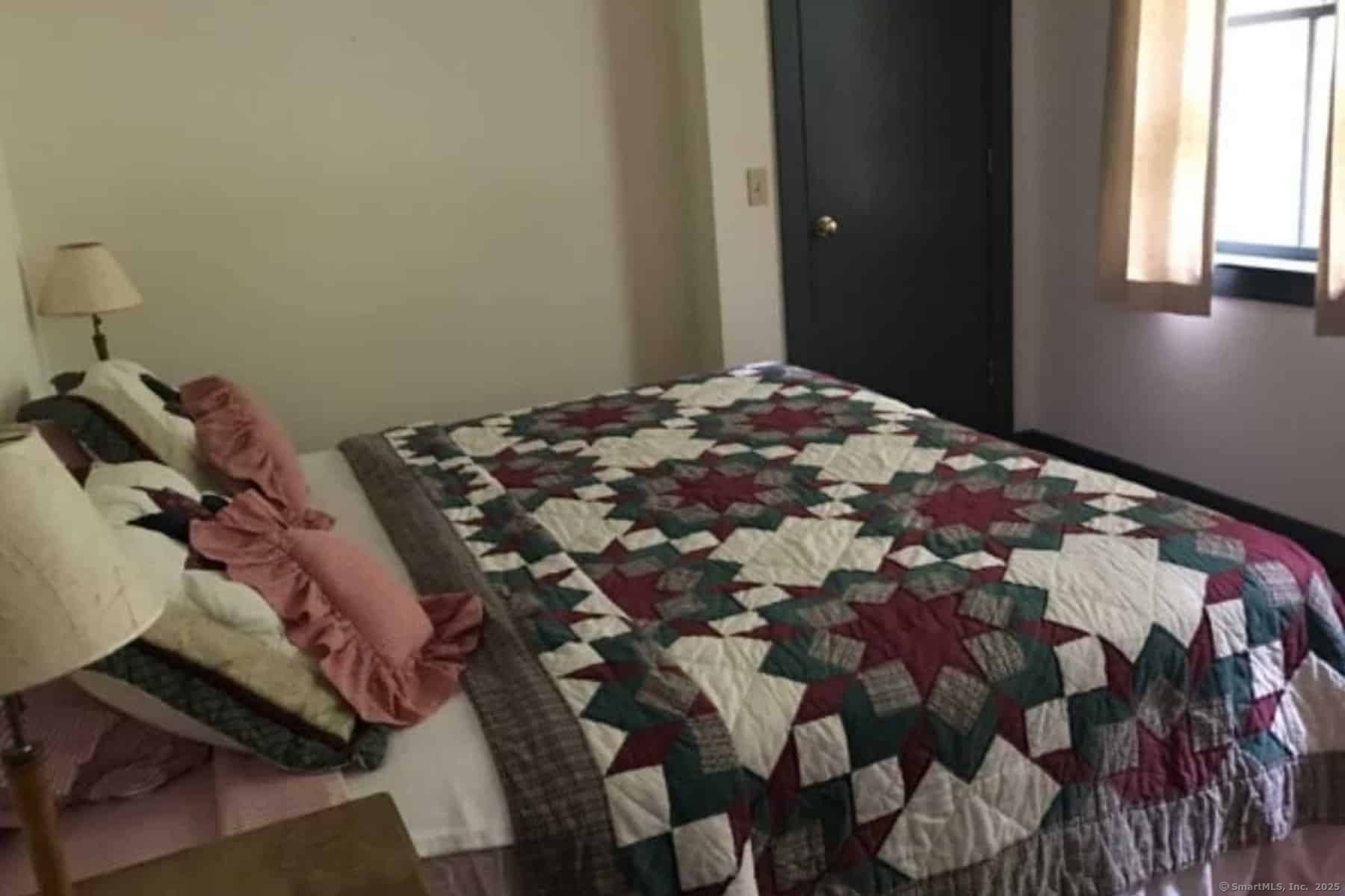 308 Twin Lakes Road Salisbury, CT 06068 - Photo 12 of 20 a bedroom with a bed and a window