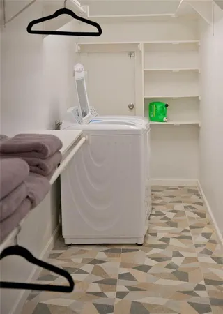 a view of a patio with table and chairs and wooden floor