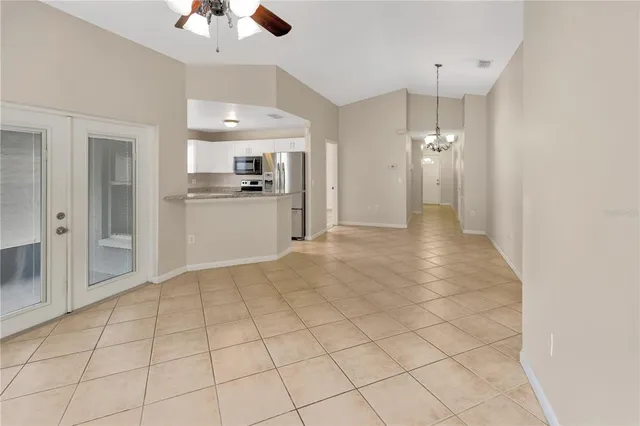 a view of a kitchen with a sink and cabinets