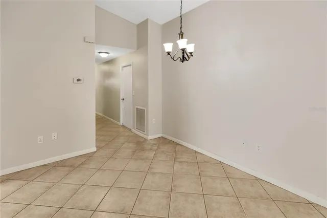 a kitchen with stainless steel appliances granite countertop a stove a sink dishwasher a refrigerator and a cabinets