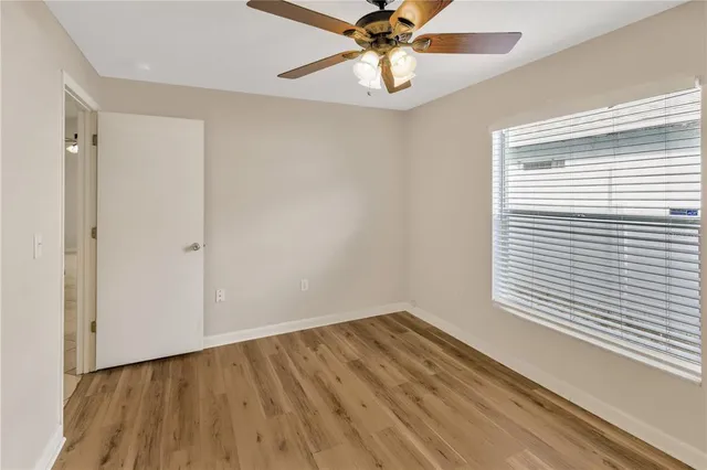 a bathroom with a sink toilet vanity and shower