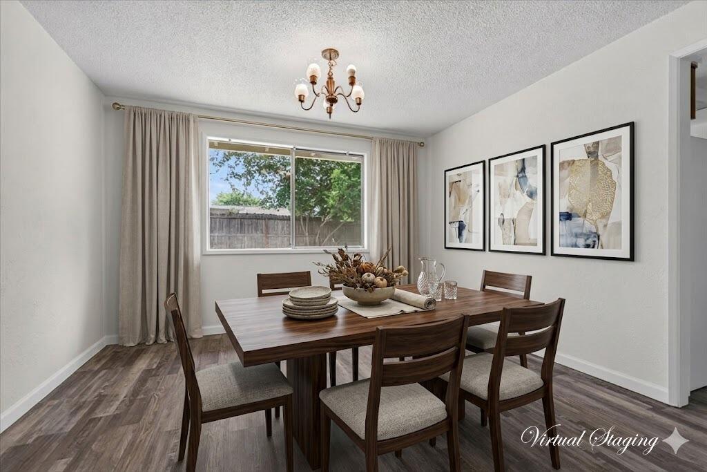 415 Sutter Avenue Medford, OR 97504 - Photo 4 of 28 a view of a dining room with furniture large window and wooden floor