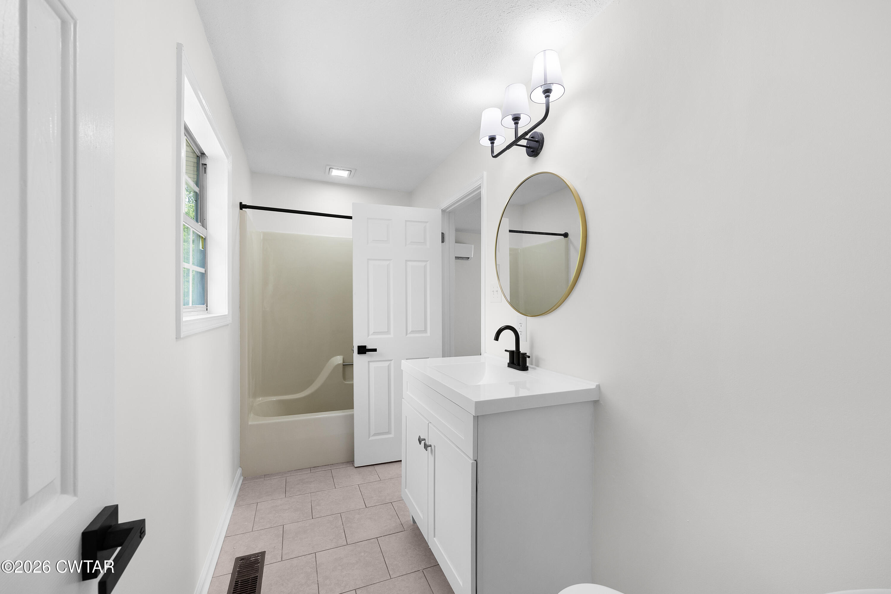 3075 Old Huntingdon Road Lexington, TN 38351 - Photo 13 of 19 a bathroom with a sink and a mirror
