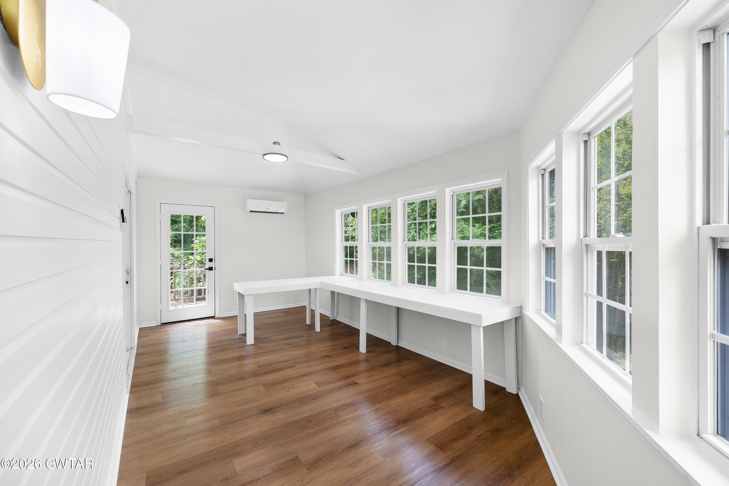3075 Old Huntingdon Road Lexington, TN 38351 - Photo 17 of 19 a view of an empty room with wooden floor and a window