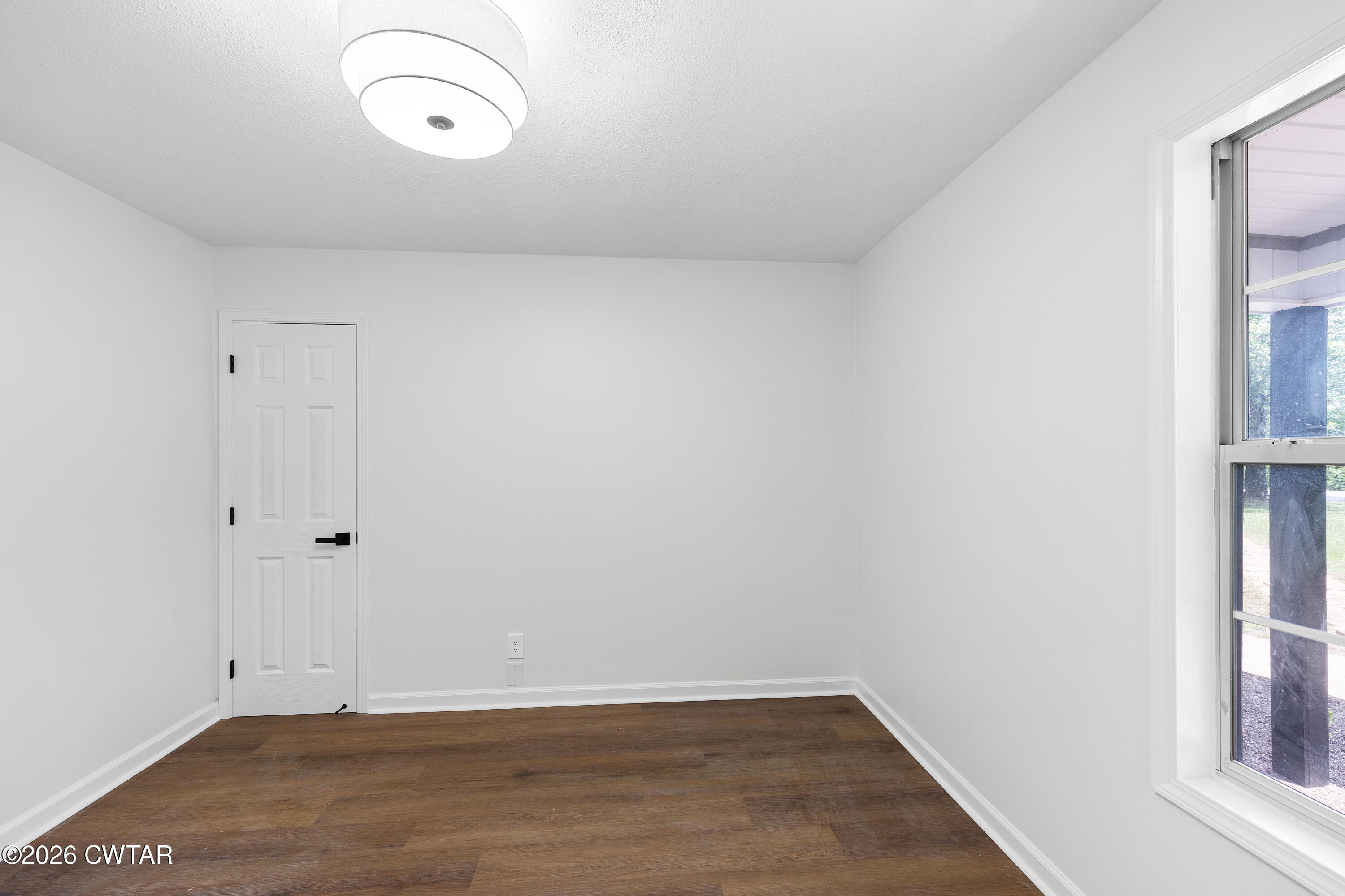 3075 Old Huntingdon Road Lexington, TN 38351 - Photo 10 of 19 a view of a room with wooden floor and windows