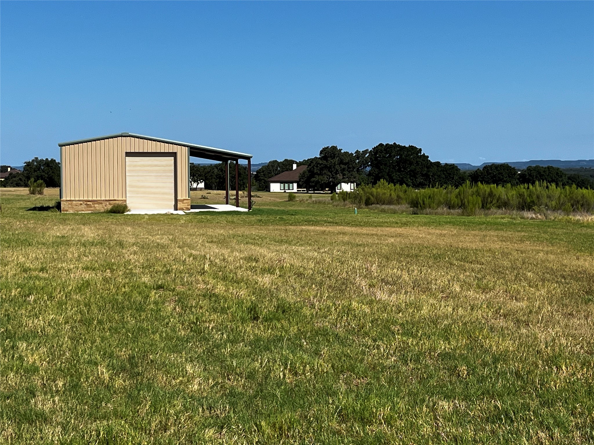 679 Palomino Springs Bandera, TX 78003 - Photo 2 of 13 a big house with a big yard