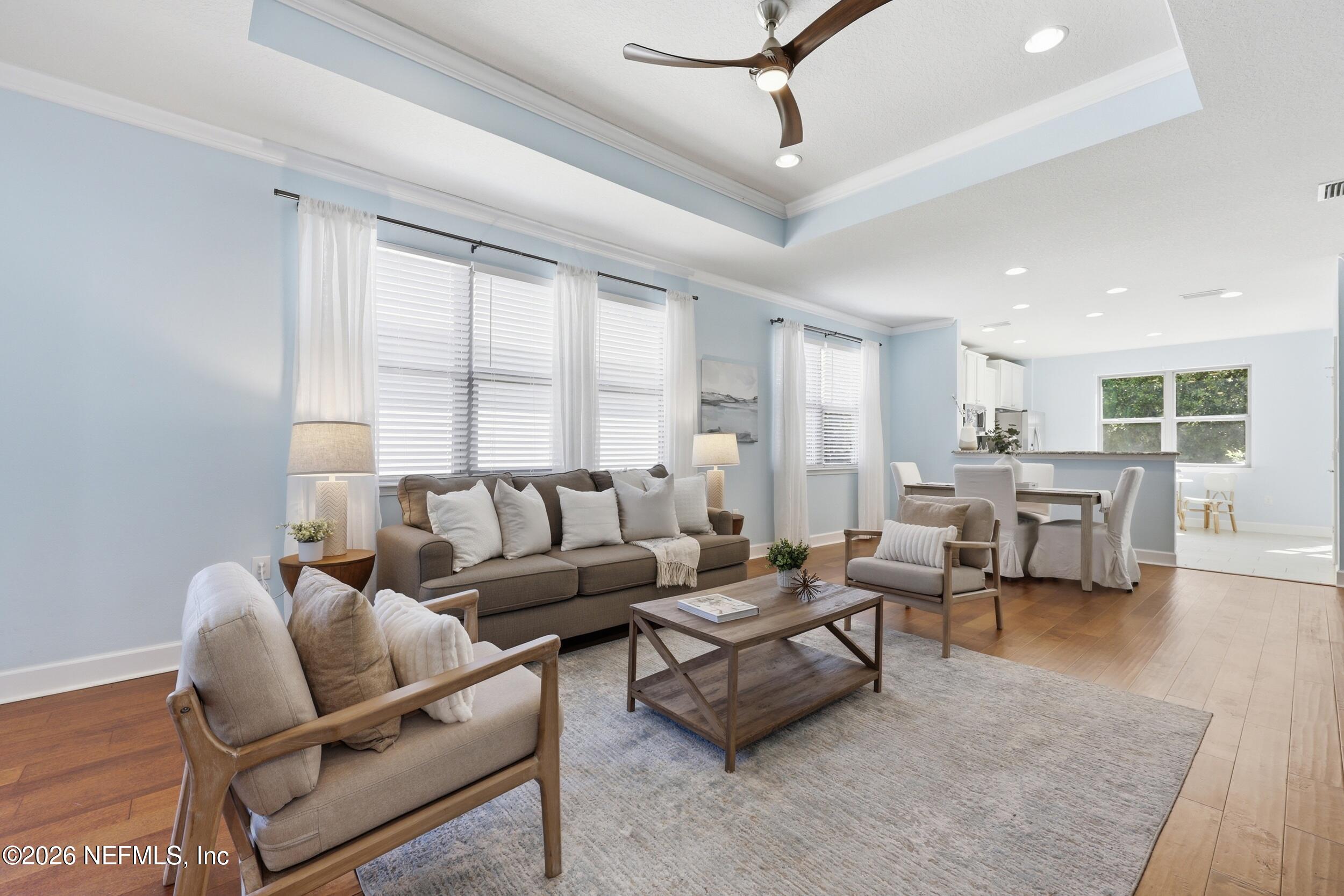 248 Hawks Harbor Road Ponte Vedra, FL 32081 - Photo 12 of 60 a living room with furniture and a large window