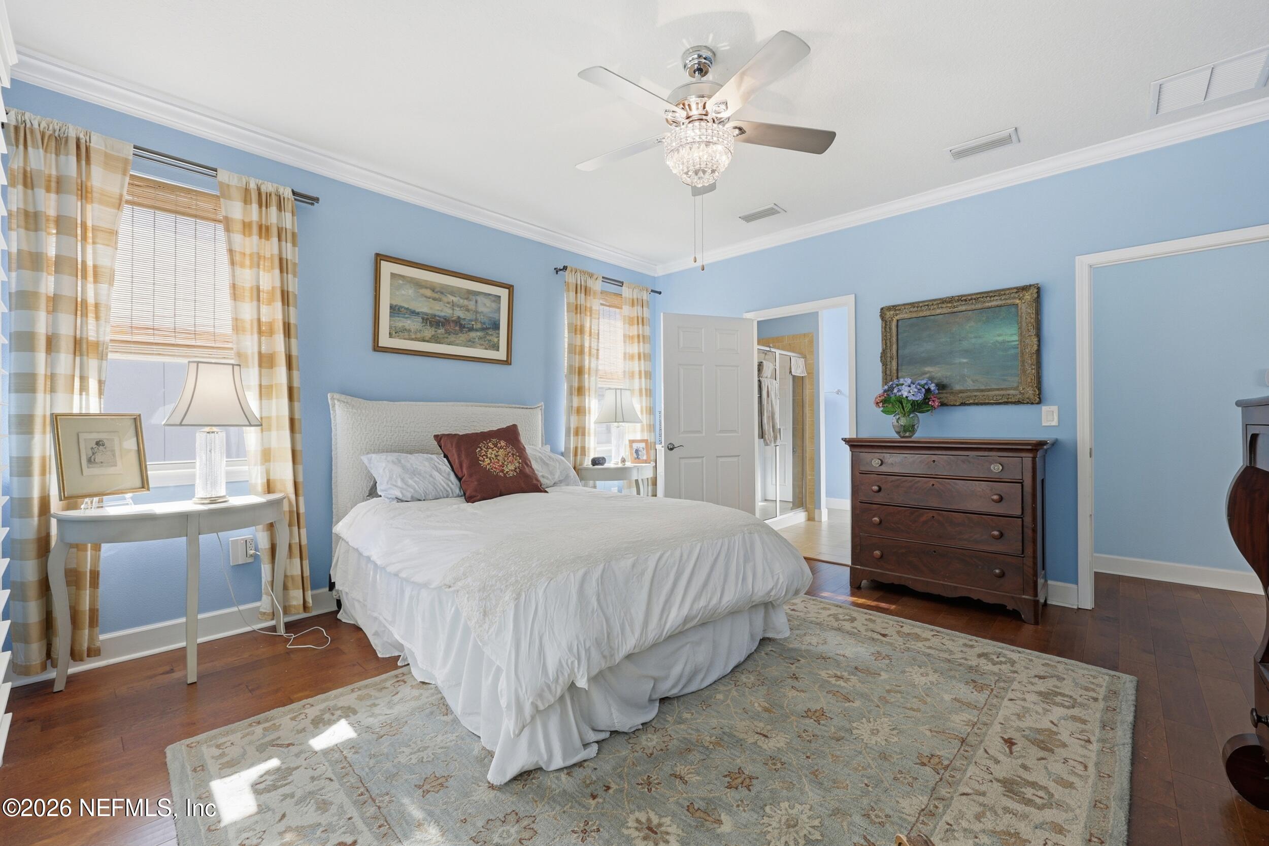 248 Hawks Harbor Road Ponte Vedra, FL 32081 - Photo 16 of 52 a bedroom with a bed a dresser and a window