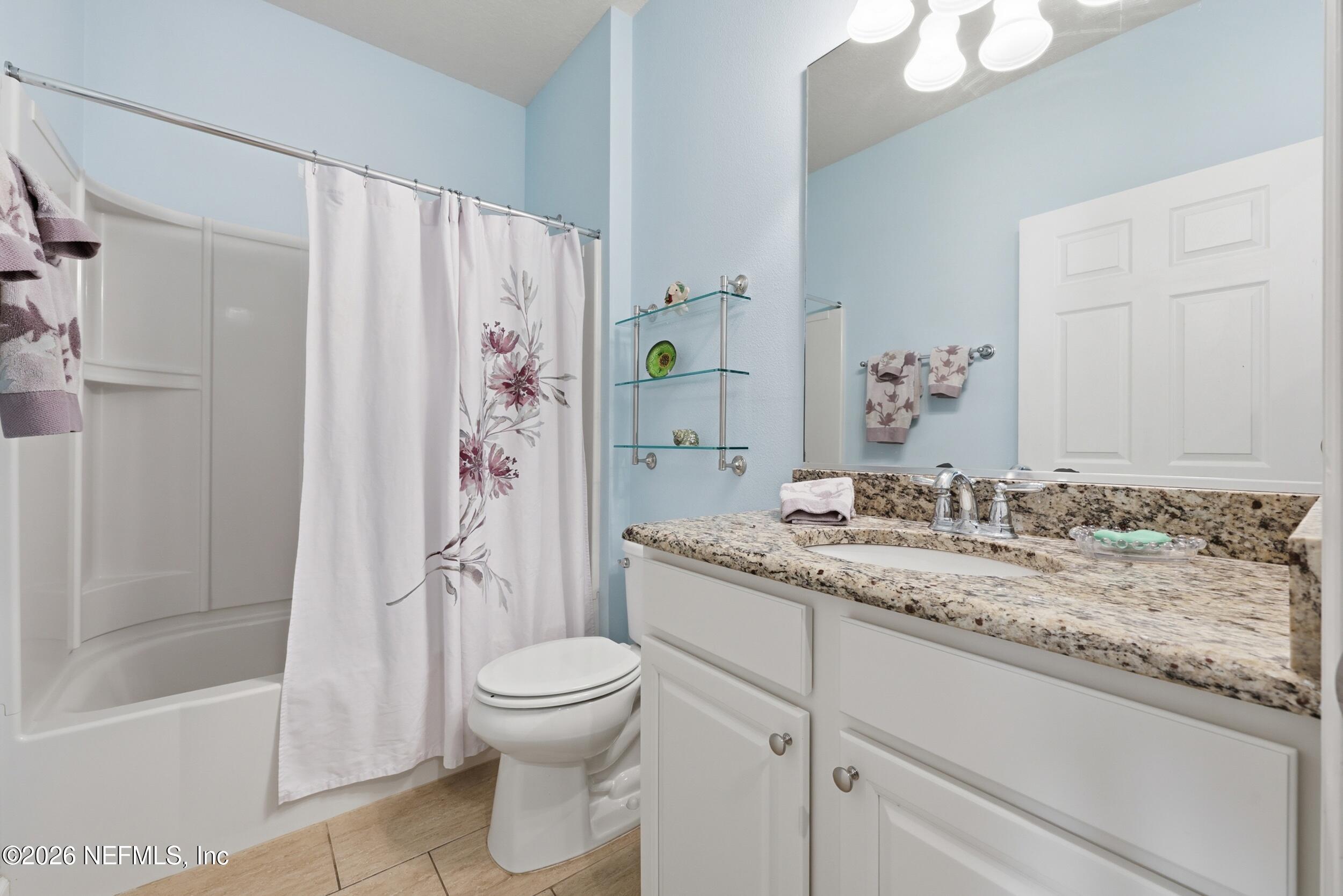 248 Hawks Harbor Road Ponte Vedra, FL 32081 - Photo 19 of 52 a bathroom with a granite countertop sink toilet and shower
