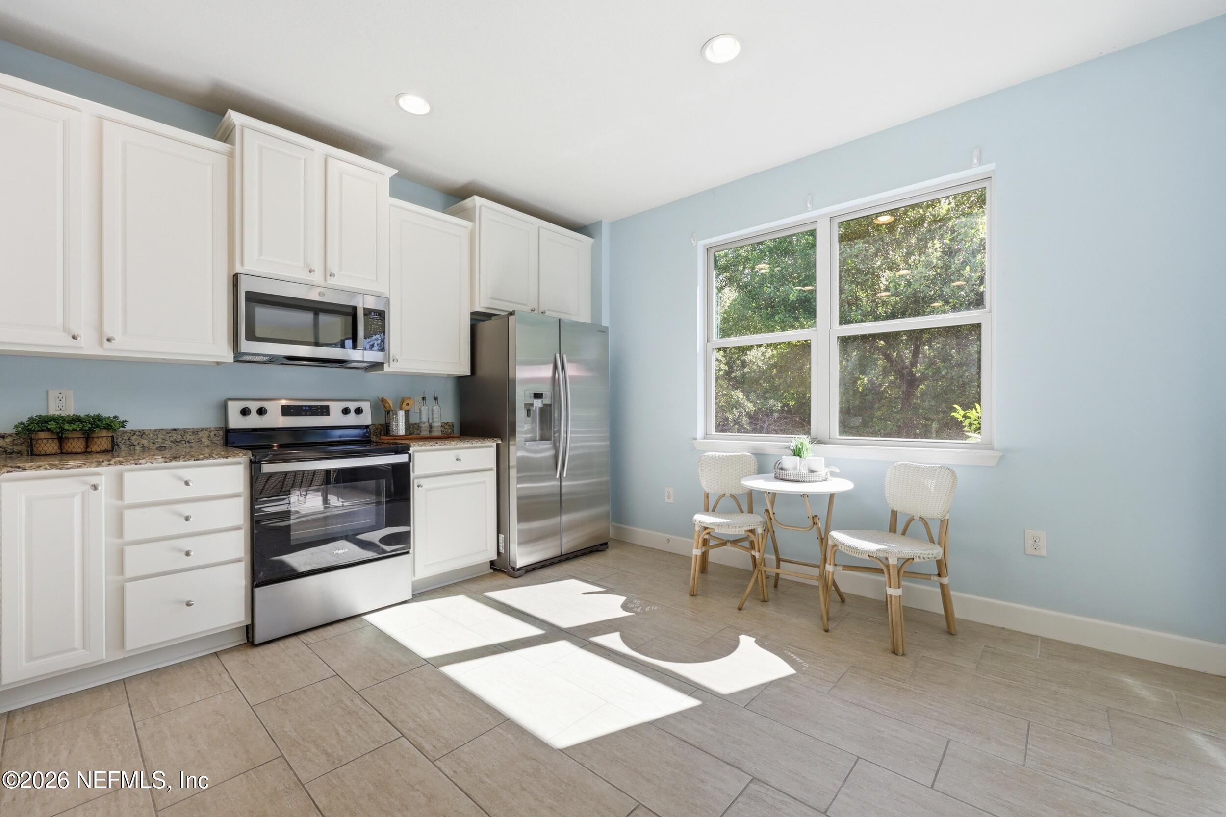 248 Hawks Harbor Road Ponte Vedra, FL 32081 - Photo 20 of 60 a kitchen with a stove a sink and a refrigerator