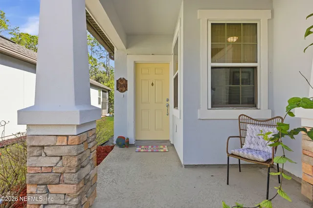 a front view of a house with outdoor seating