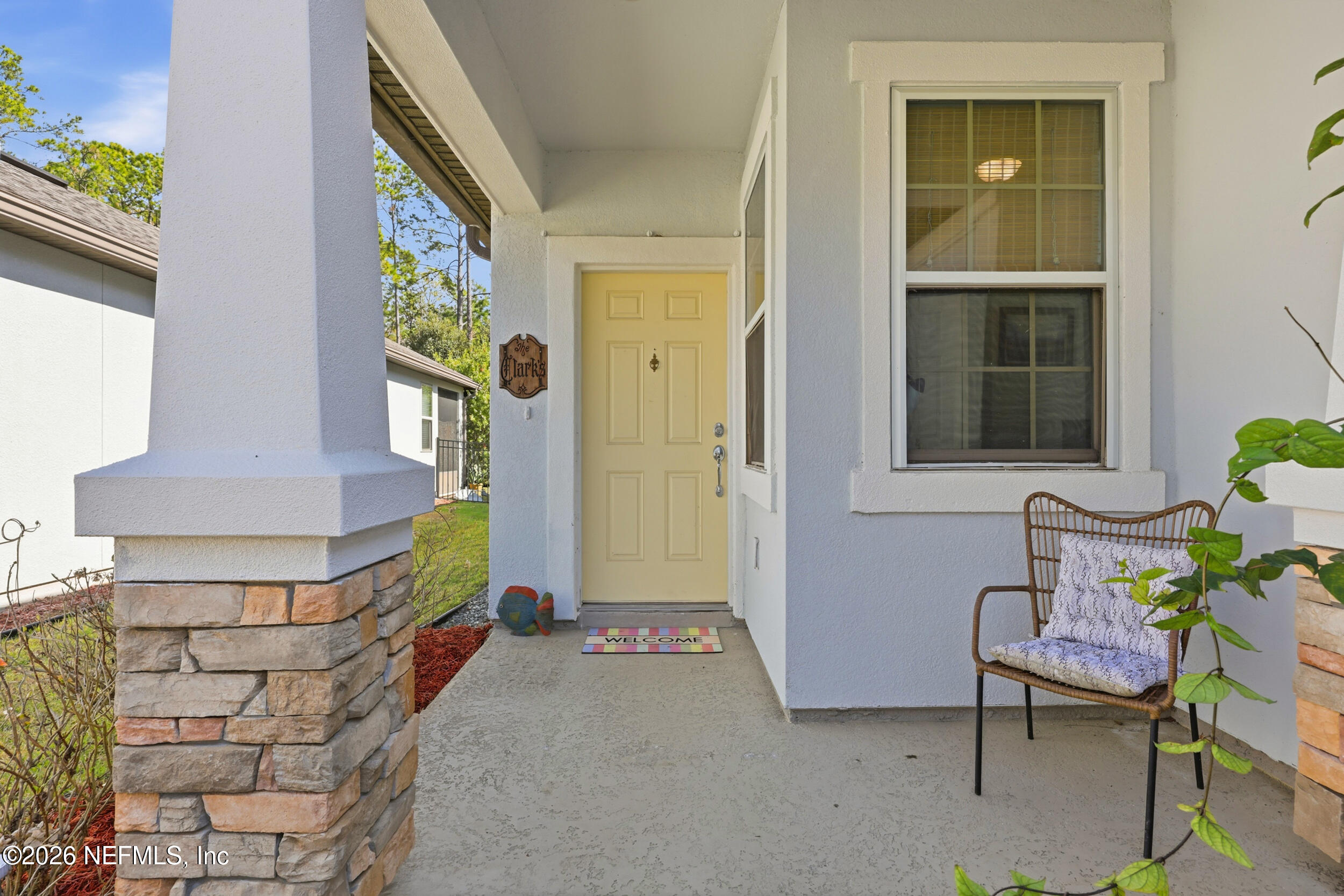 248 Hawks Harbor Road Ponte Vedra, FL 32081 - Photo 2 of 52 a front view of a house with outdoor seating