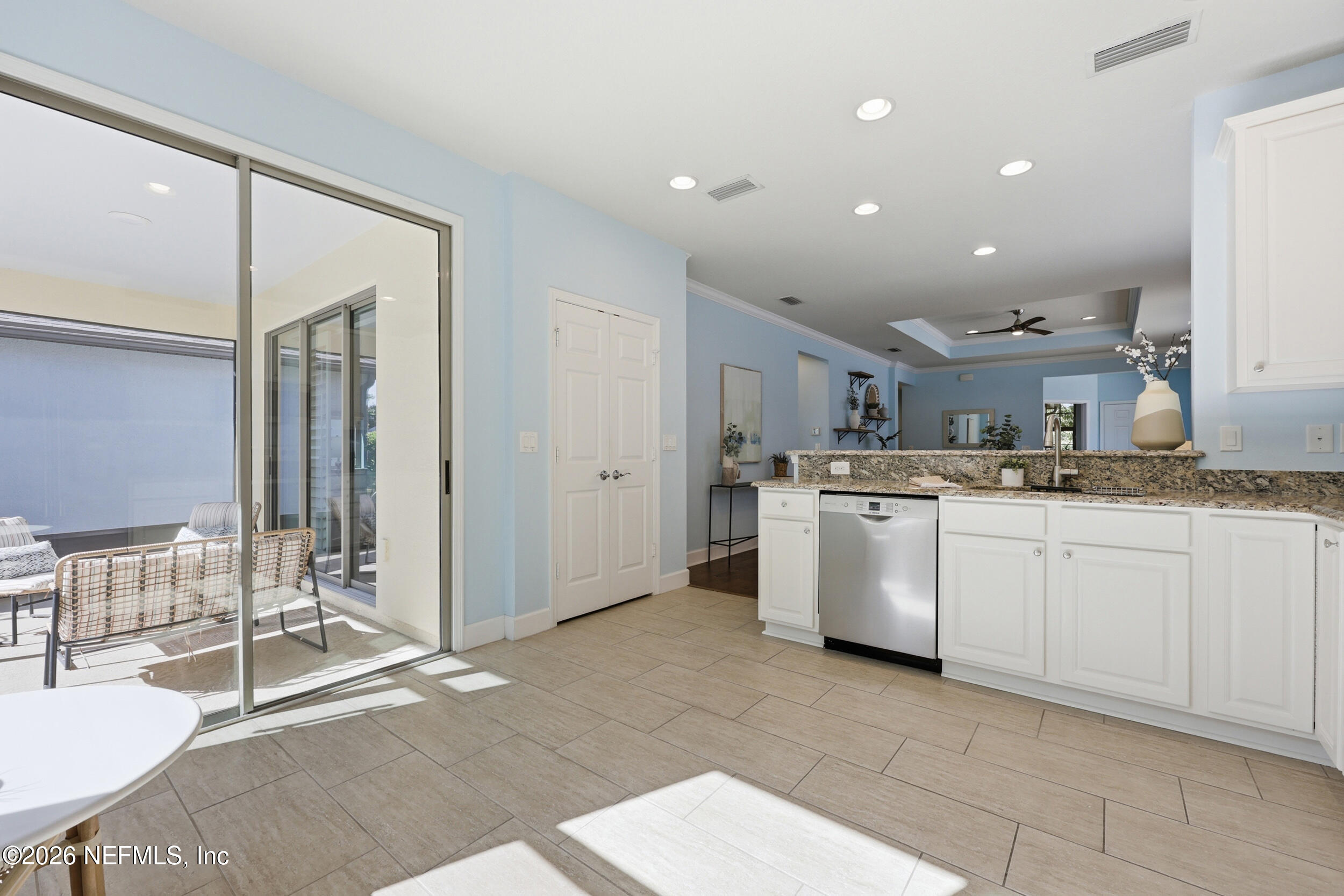 248 Hawks Harbor Road Ponte Vedra, FL 32081 - Photo 21 of 60 a kitchen with white cabinets and white appliances