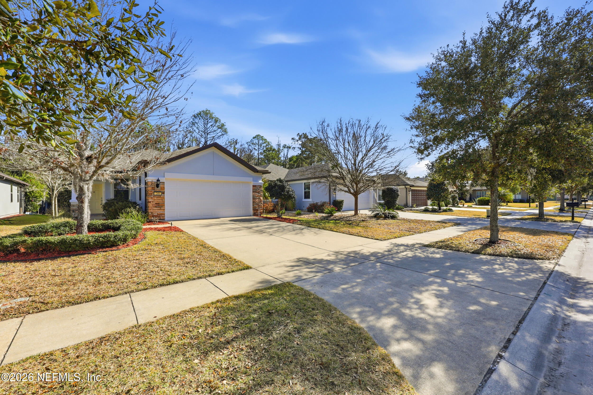 248 Hawks Harbor Road Ponte Vedra, FL 32081 - Photo 33 of 60 a house with trees in the background