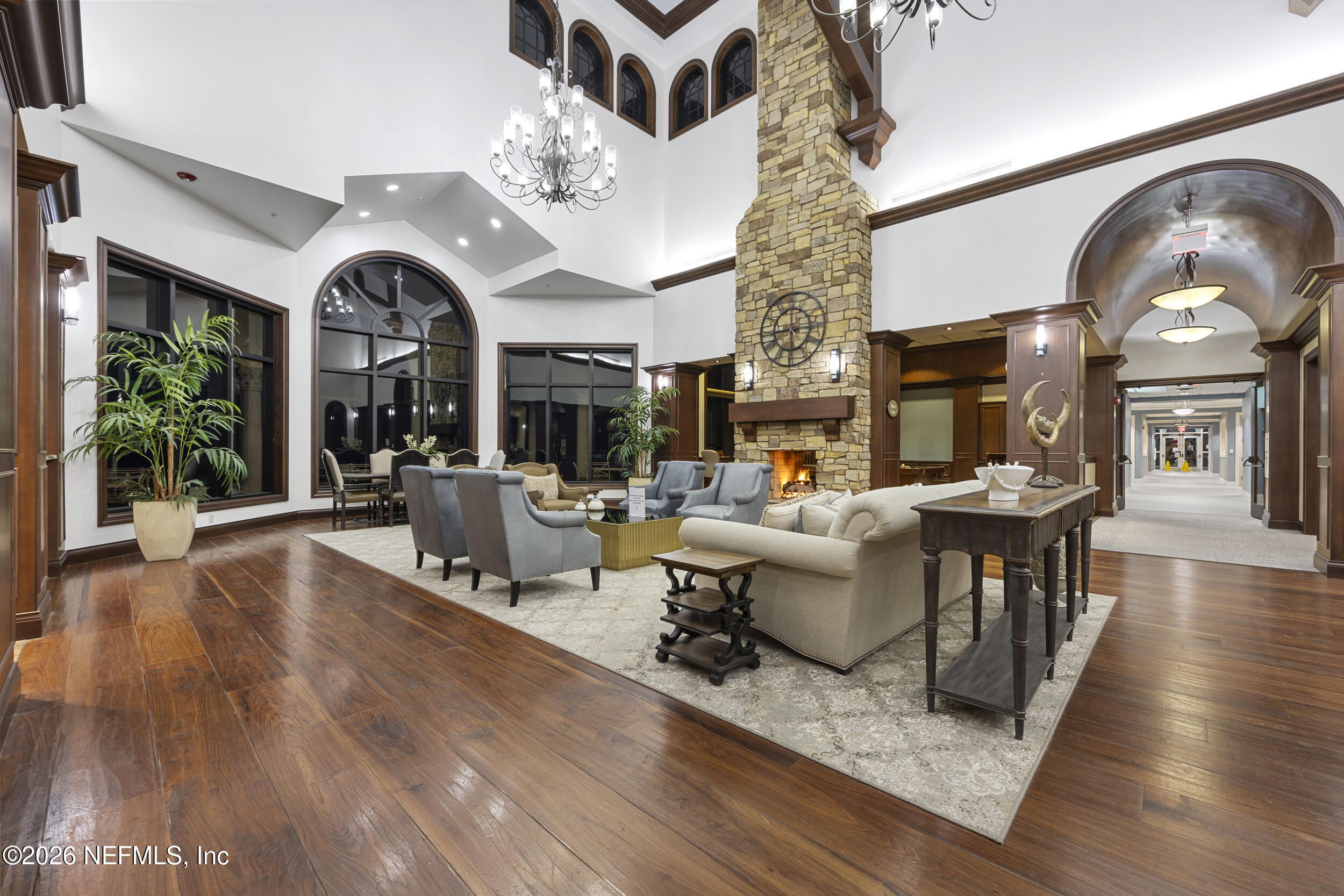 248 Hawks Harbor Road Ponte Vedra, FL 32081 - Photo 35 of 60 a living room with furniture a large window and wooden floor