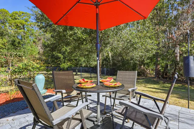 a view of a backyard with sitting area