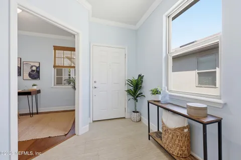 a view of a livingroom with furniture and entryway