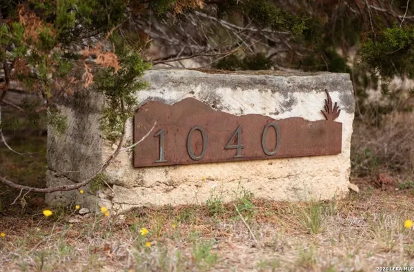 a sign that is sitting on a wooden floor