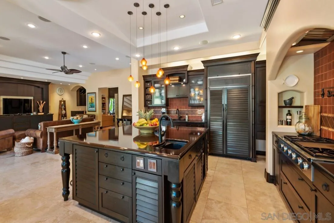 13862 Deergrass Court Poway, CA 92064 - Photo 13 of 51 a kitchen with stainless steel appliances granite countertop a stove and a refrigerator
