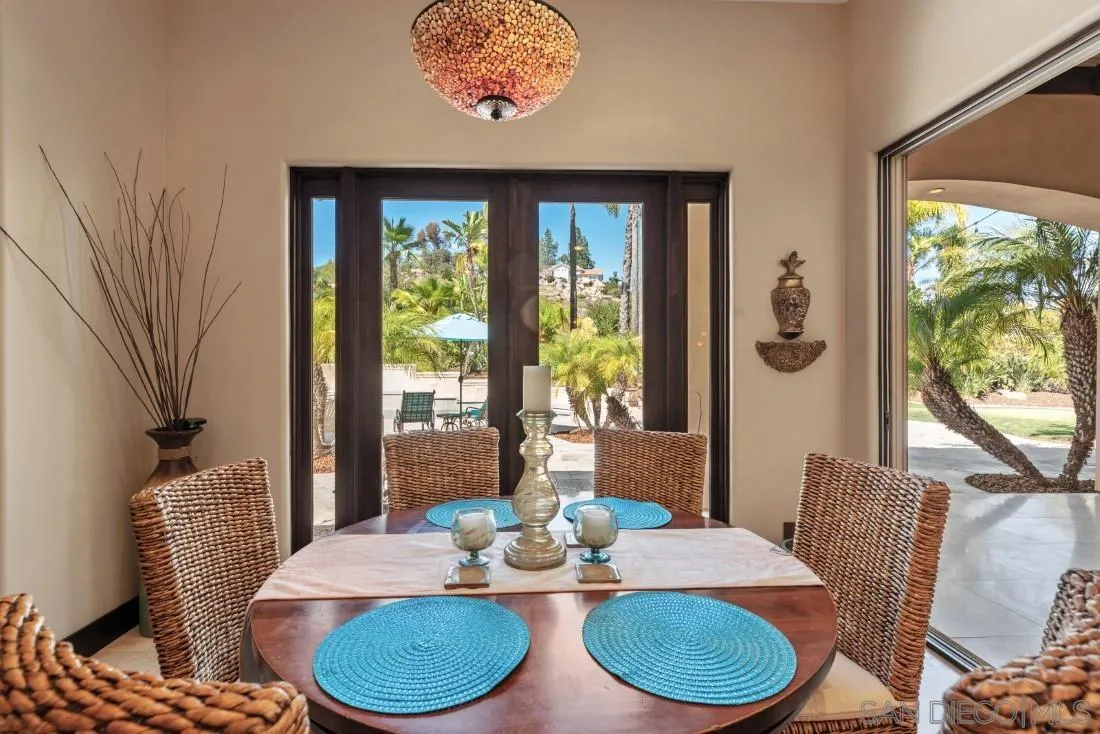 13862 Deergrass Court Poway, CA 92064 - Photo 16 of 51 a dining room with furniture a rug and a large window