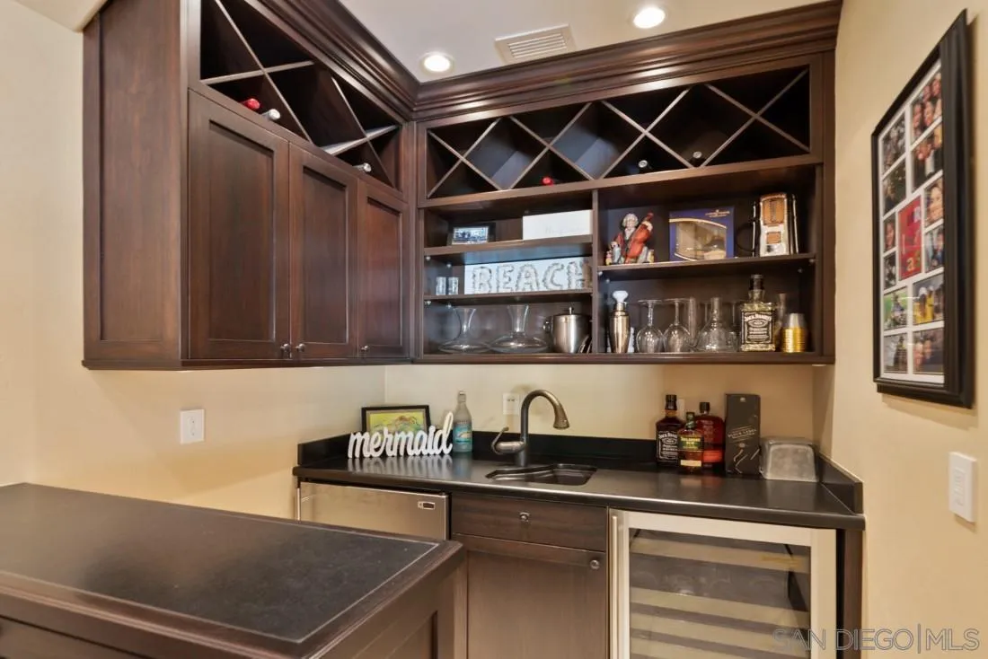 13862 Deergrass Court Poway, CA 92064 - Photo 17 of 51 a kitchen with stainless steel appliances granite countertop a sink and cabinets