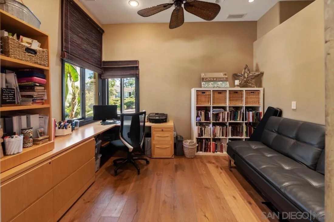 13862 Deergrass Court Poway, CA 92064 - Photo 18 of 51 a living room with furniture and a book shelf