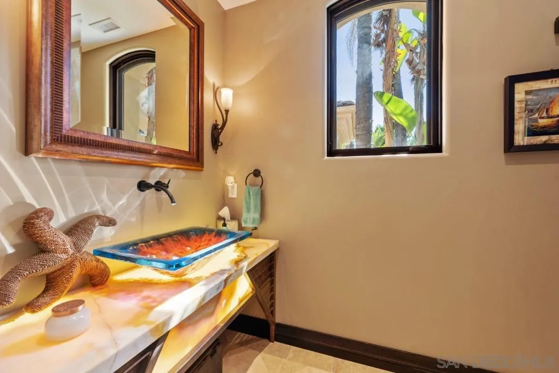 13862 Deergrass Court Poway, CA 92064 - Photo 19 of 51 a bathroom with a sink and a mirror