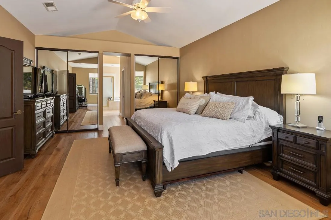 13862 Deergrass Court Poway, CA 92064 - Photo 24 of 51 a spacious bedroom with a bed and a walk in closet