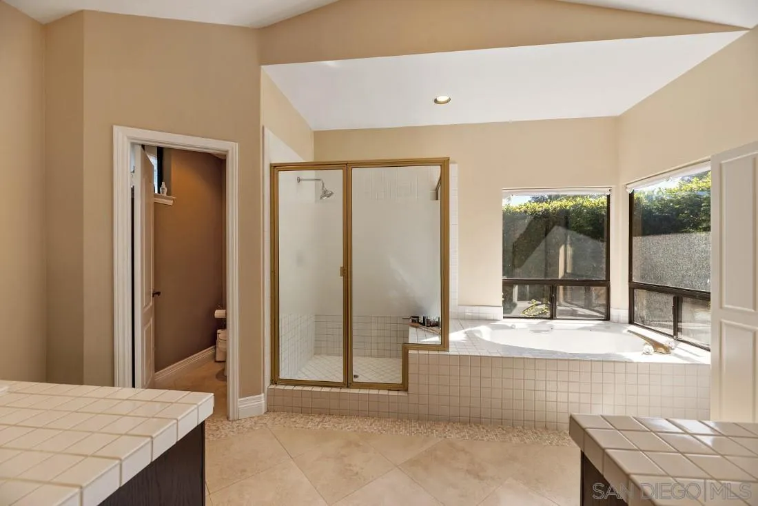 13862 Deergrass Court Poway, CA 92064 - Photo 27 of 51 a bathroom with a tub and shower