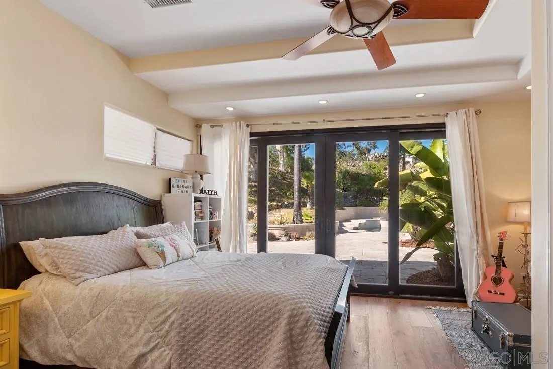 13862 Deergrass Court Poway, CA 92064 - Photo 28 of 51 a bedroom with a bed and a large window