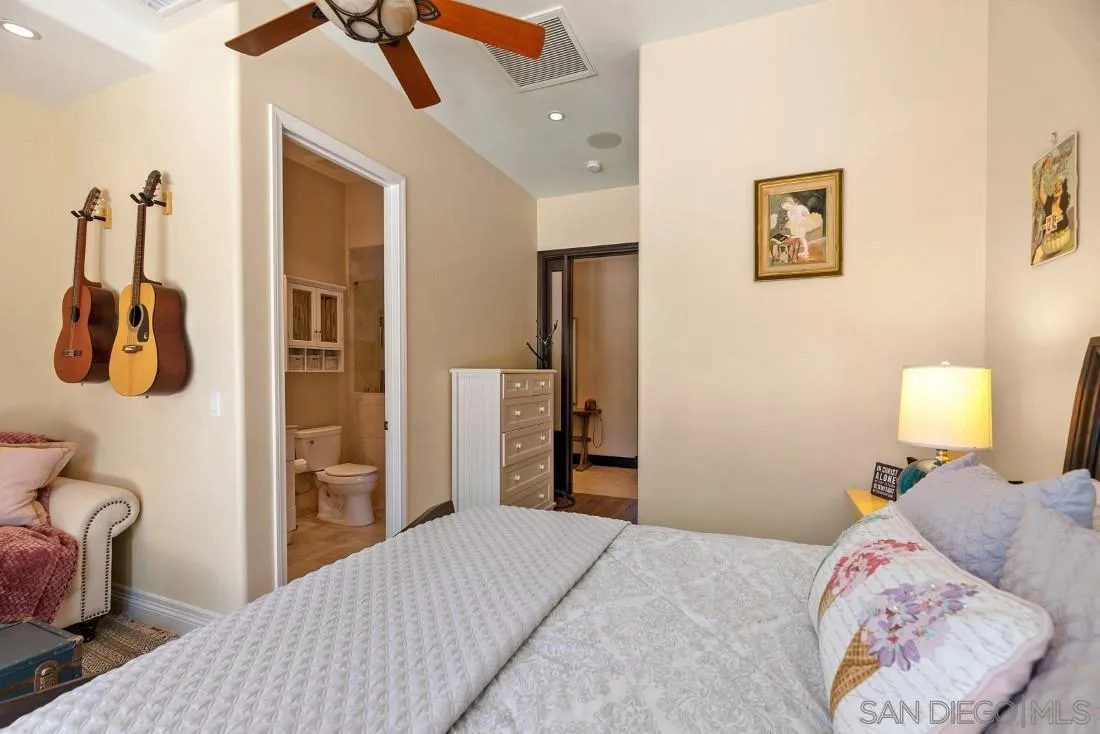 13862 Deergrass Court Poway, CA 92064 - Photo 29 of 51 a bedroom with a bed and a table