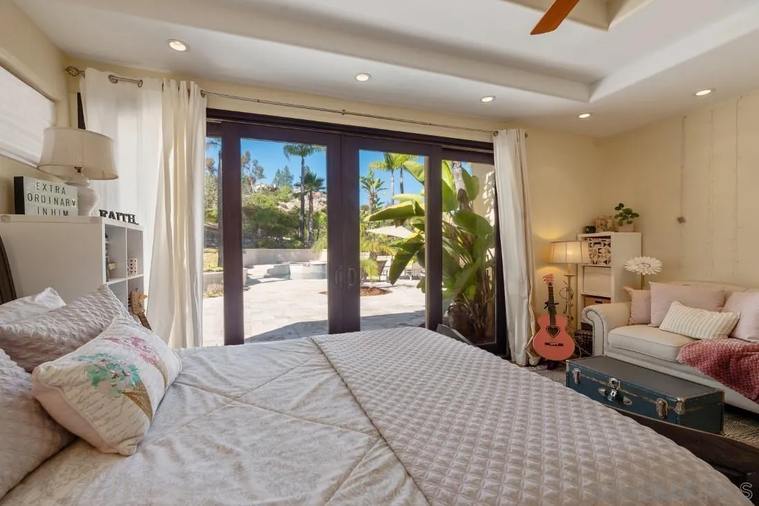 13862 Deergrass Court Poway, CA 92064 - Photo 30 of 51 a bedroom with a large bed and a large window