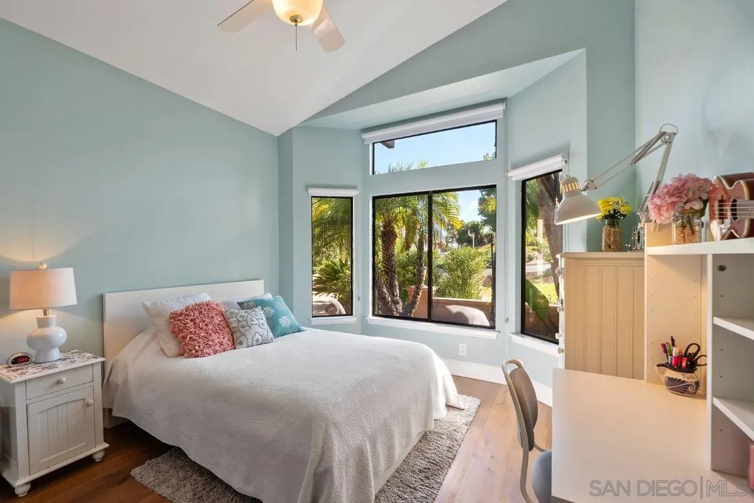 13862 Deergrass Court Poway, CA 92064 - Photo 32 of 51 a bedroom with a bed and a chandelier