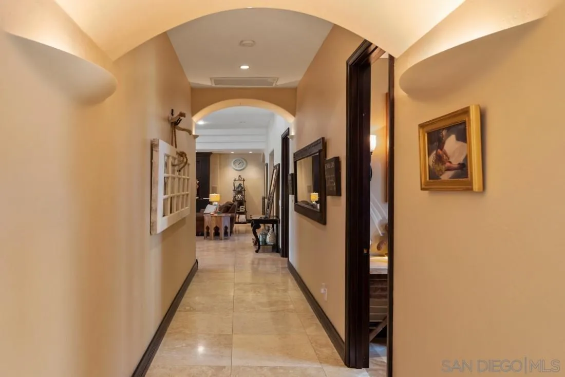 13862 Deergrass Court Poway, CA 92064 - Photo 4 of 51 a view of a hallway with a livingroom and a livingroom with furniture