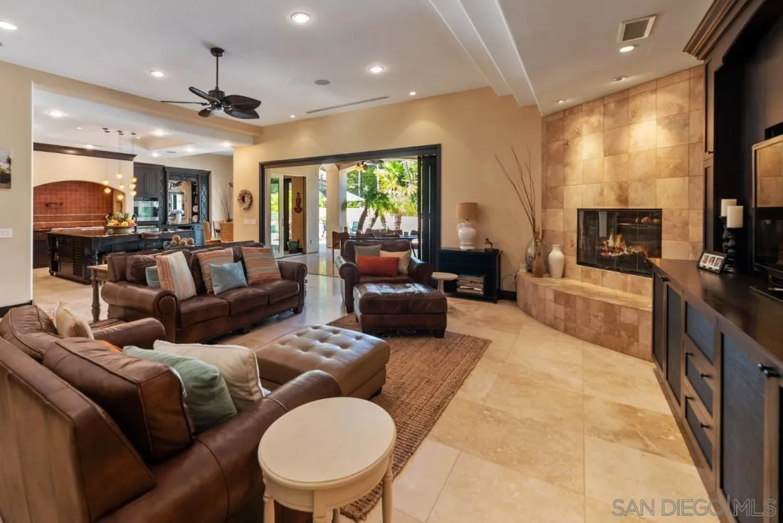 13862 Deergrass Court Poway, CA 92064 - Photo 5 of 51 a living room with furniture a large window and a flat screen tv