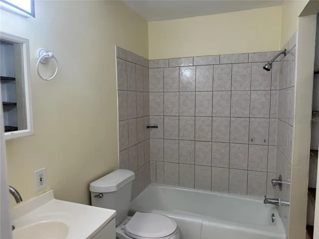 an empty room with closet area