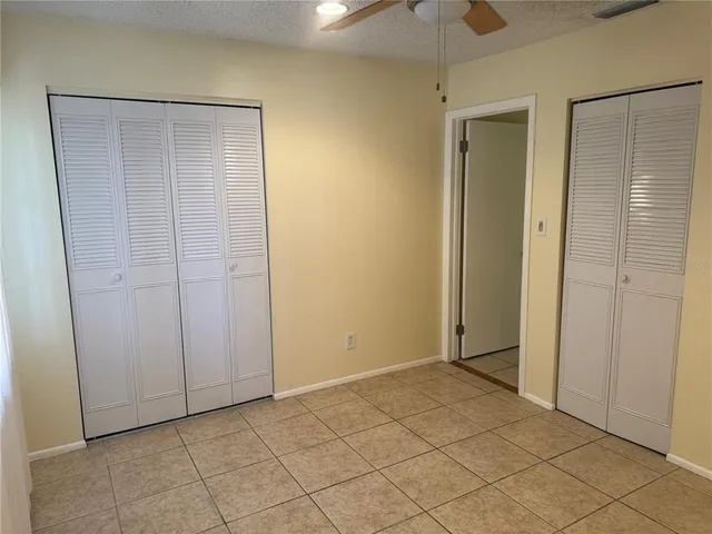 a view of an empty room with windows