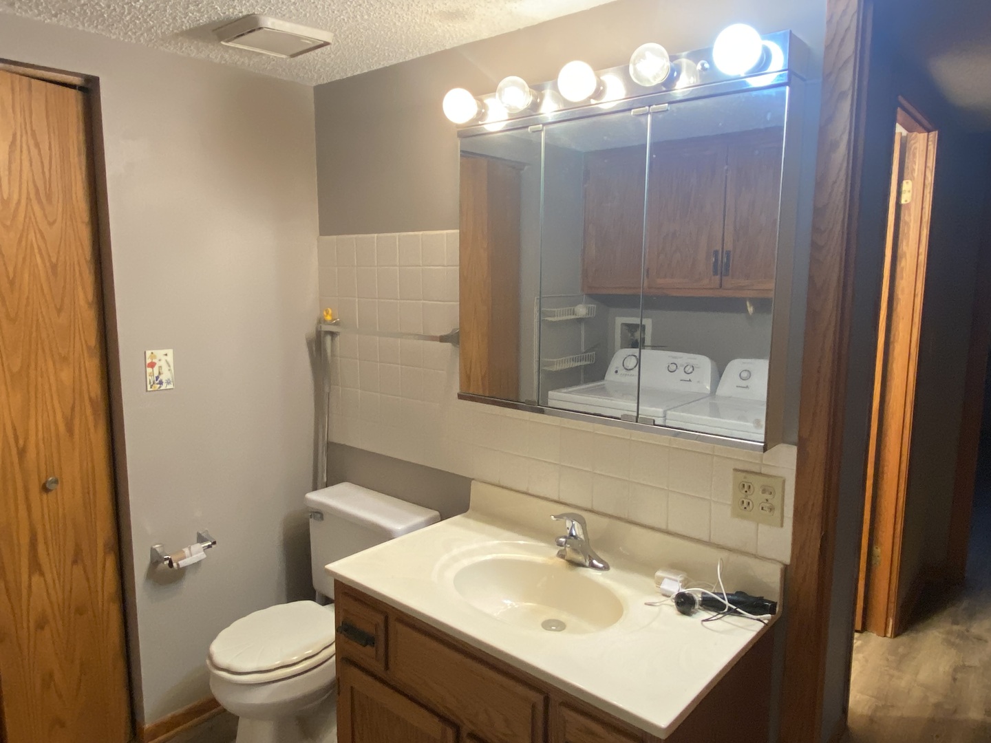 1105 East Division Street, Unit 1B Lockport, IL 60441 - Photo 12 of 22 a bathroom with a sink toilet and shower