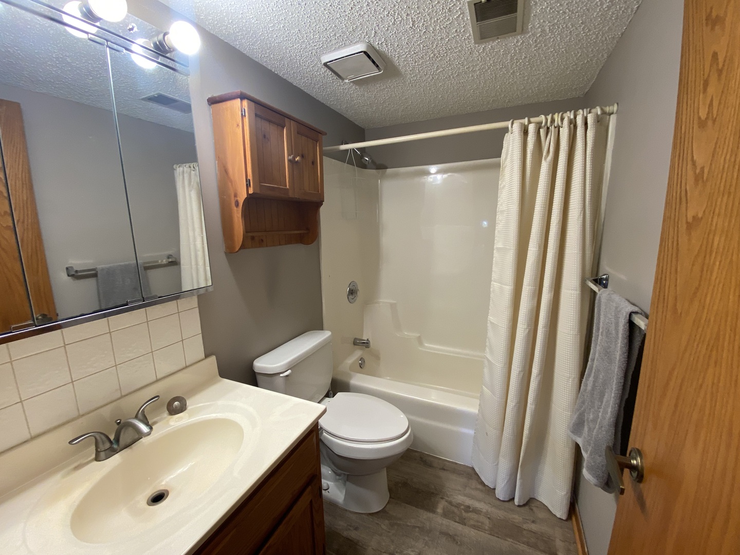 1105 East Division Street, Unit 1B Lockport, IL 60441 - Photo 15 of 22 a bathroom with a sink toilet and shower