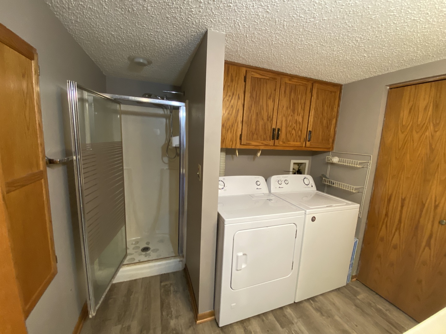 1105 East Division Street, Unit 1B Lockport, IL 60441 - Photo 18 of 22 a bathroom with a sink a toilet and shower