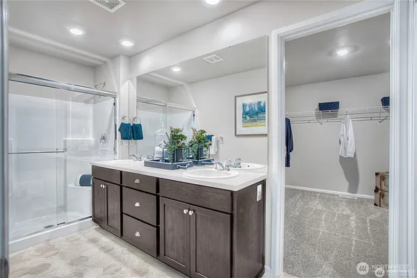 a bathroom with a granite countertop sink mirror and double