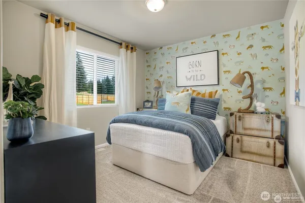 a bedroom with a bed and a potted plant