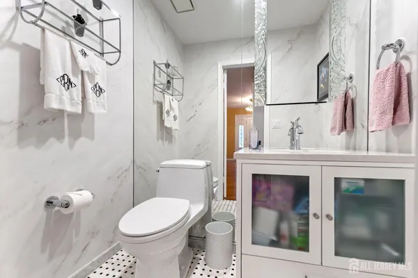 a bathroom with a toilet sink and shower