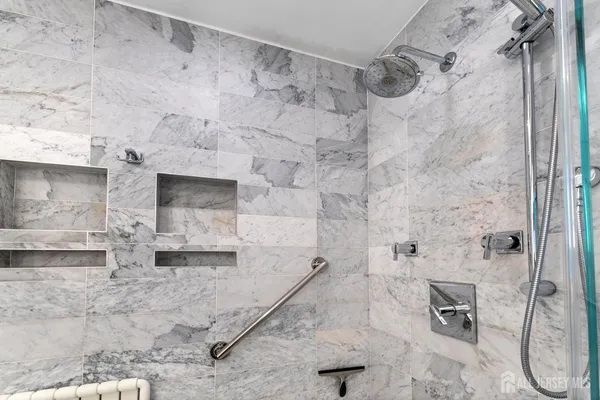 a bedroom with a bed and a television