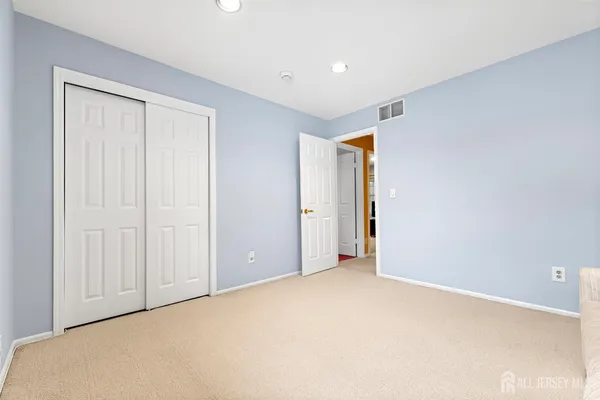 a room with wooden floor and furniture
