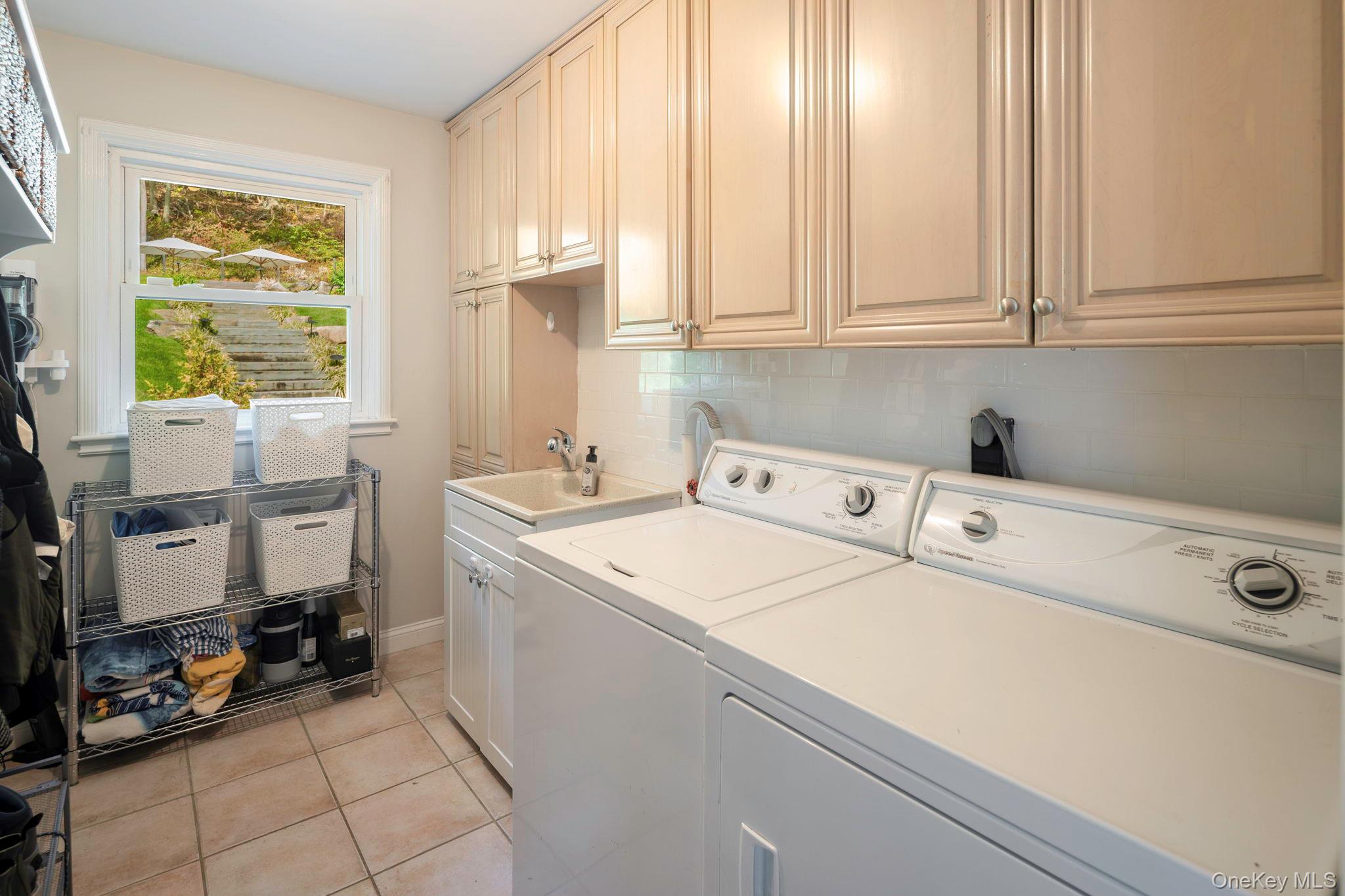 36 Pond Hill Road Chappaqua, NY 10514 - Photo 14 of 32 a utility room with dryer and washer