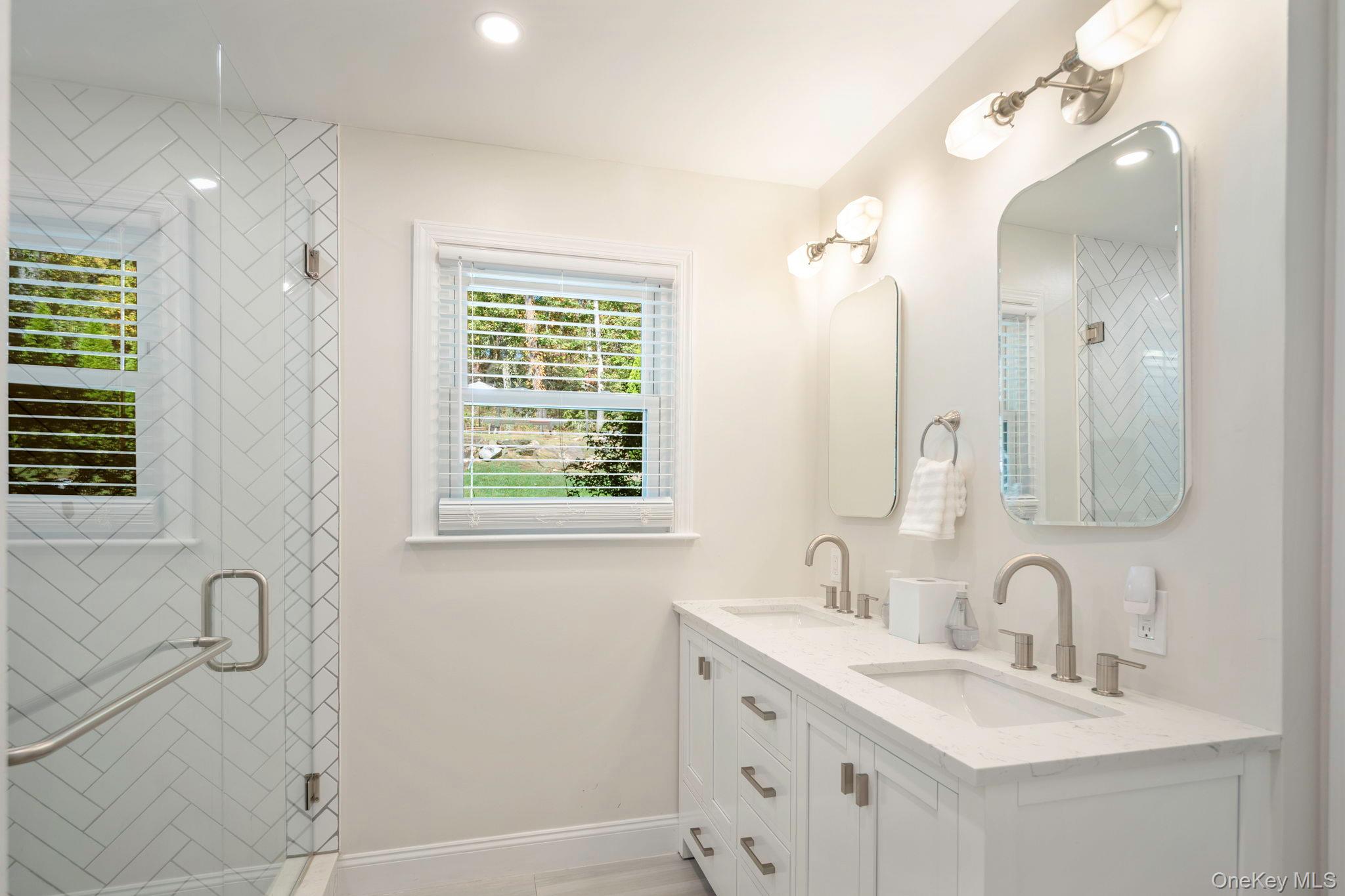 36 Pond Hill Road Chappaqua, NY 10514 - Photo 17 of 32 a bathroom with a double vanity sink mirror and double