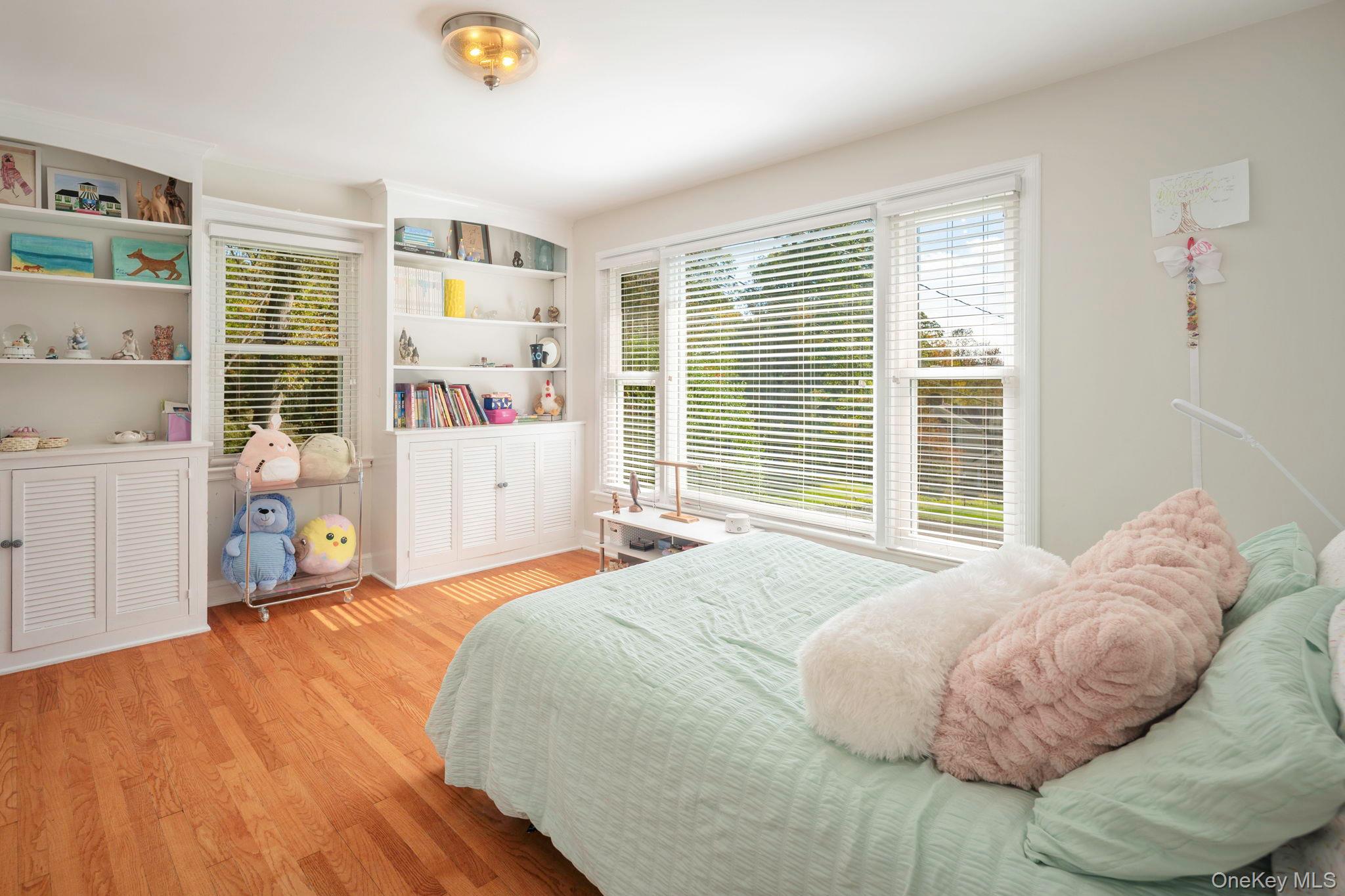 36 Pond Hill Road Chappaqua, NY 10514 - Photo 18 of 32 a bedroom with a bed and a large window with the outer view