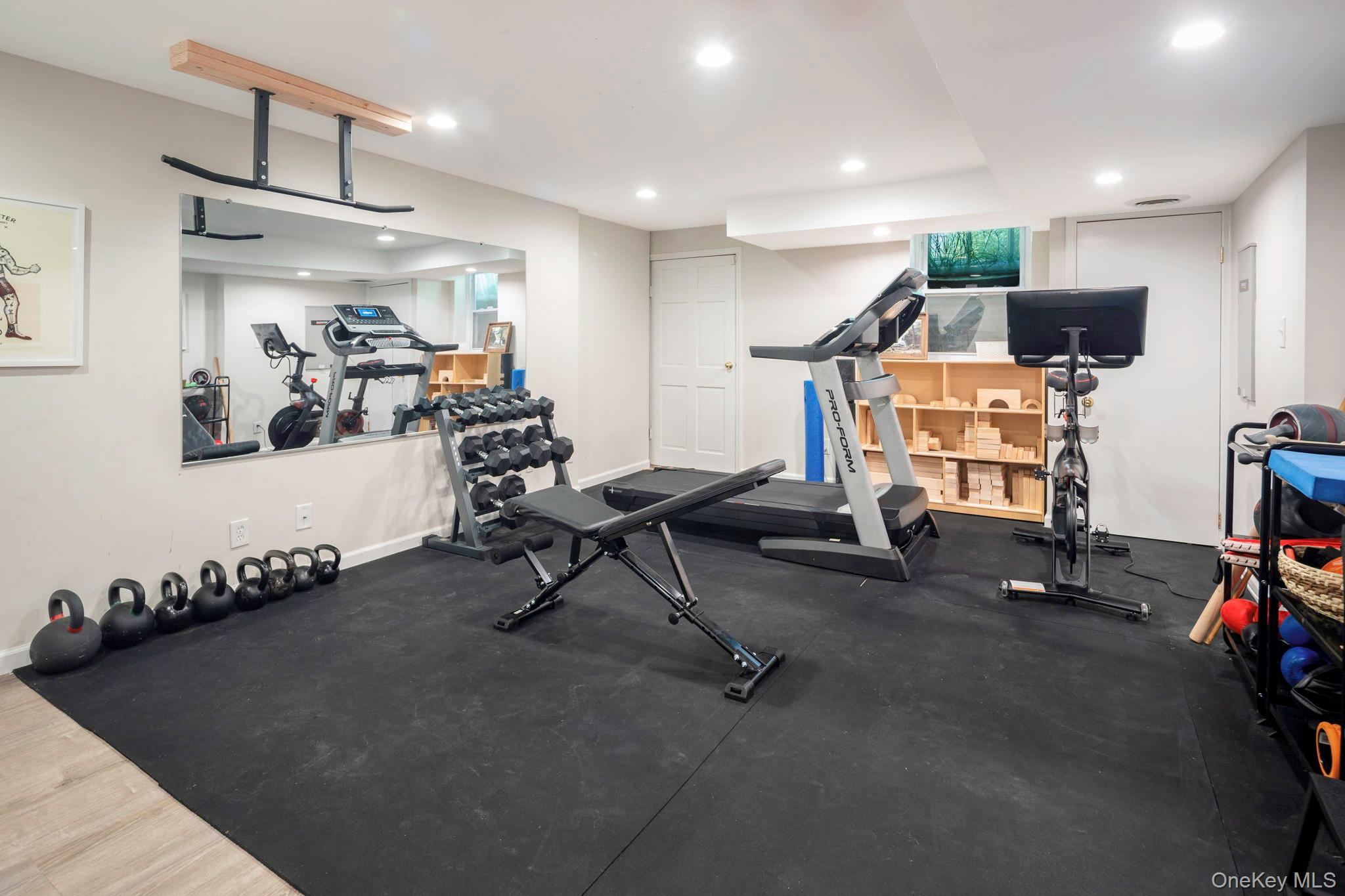 36 Pond Hill Road Chappaqua, NY 10514 - Photo 23 of 32 a view of a room with gym equipment